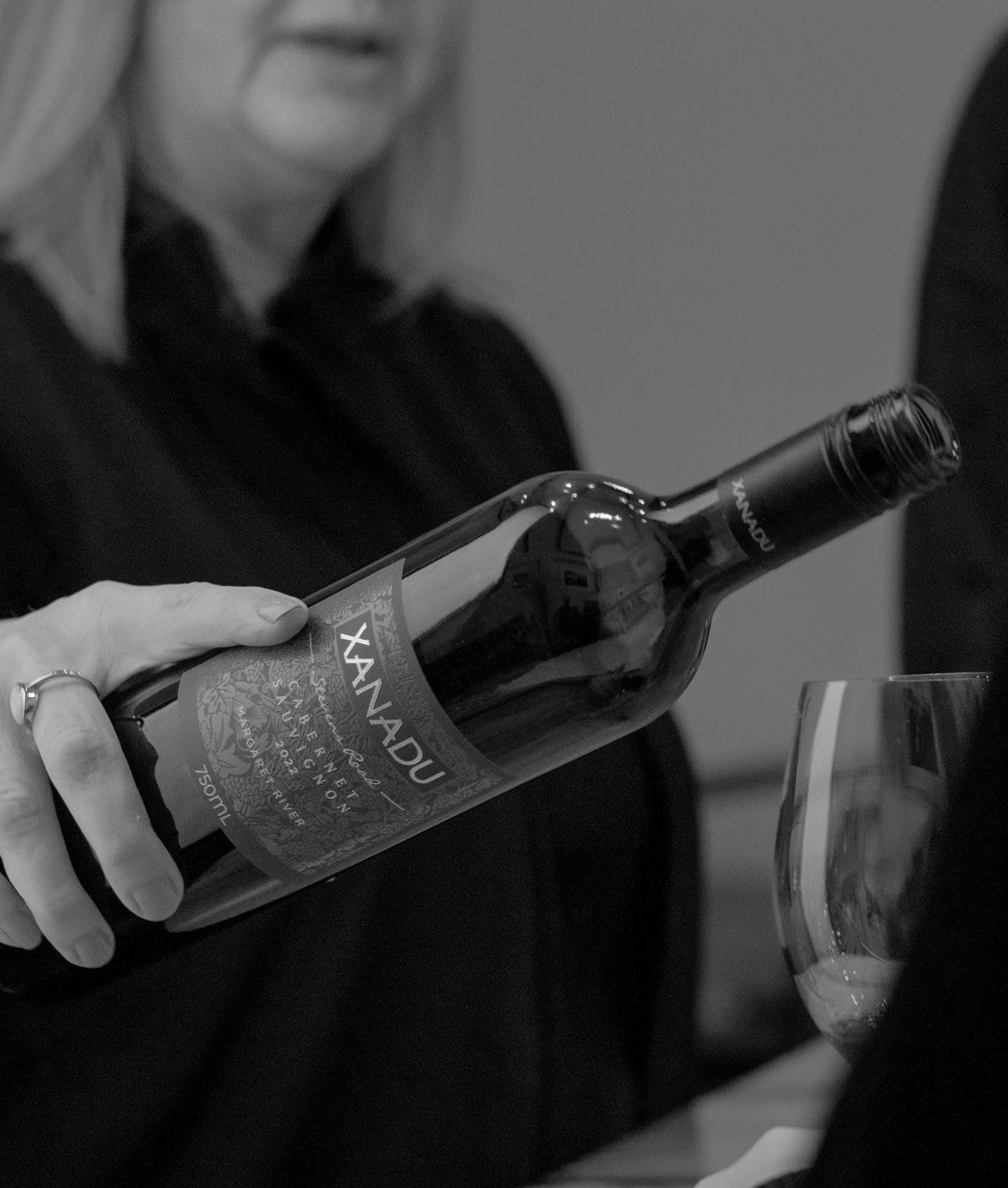 Woman pours Xanadu Stevens Road Cabernet Sauvignon