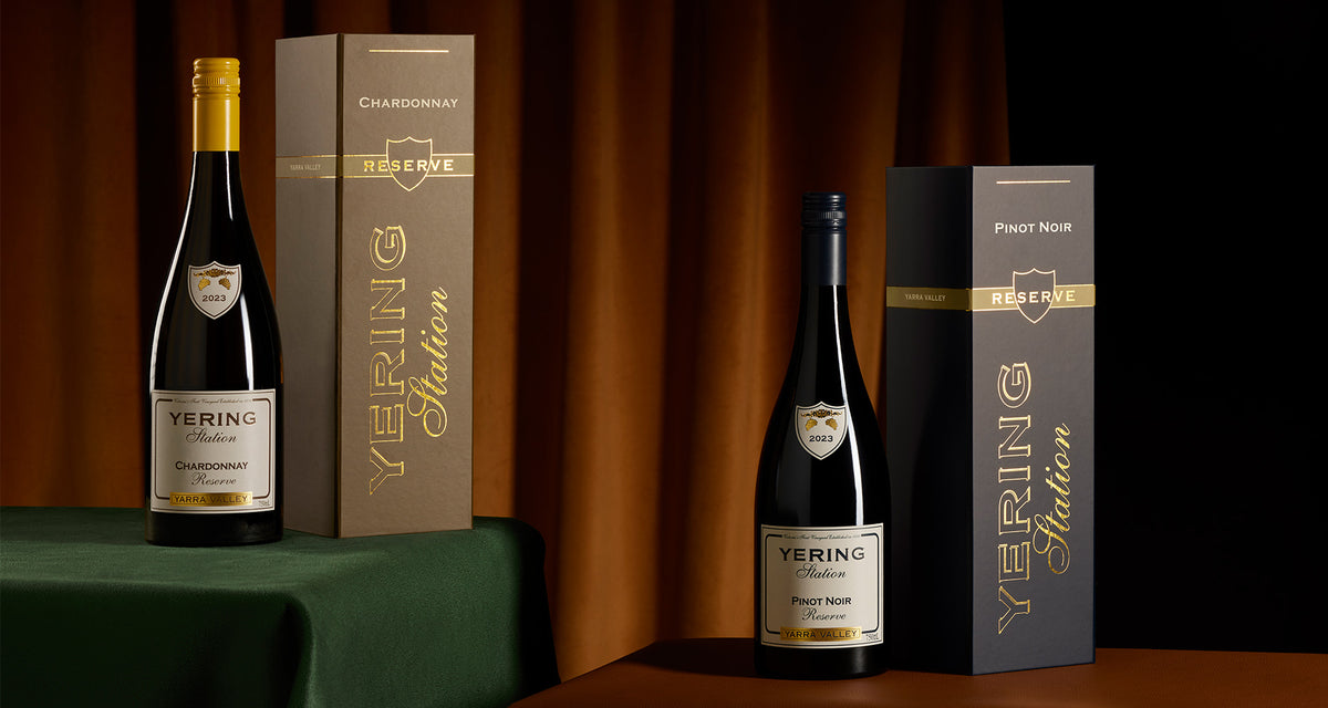 Yering Station Chardonnay Reserve and Pinot Noir Reserve bottles with gift boxes on a table, wine club banner